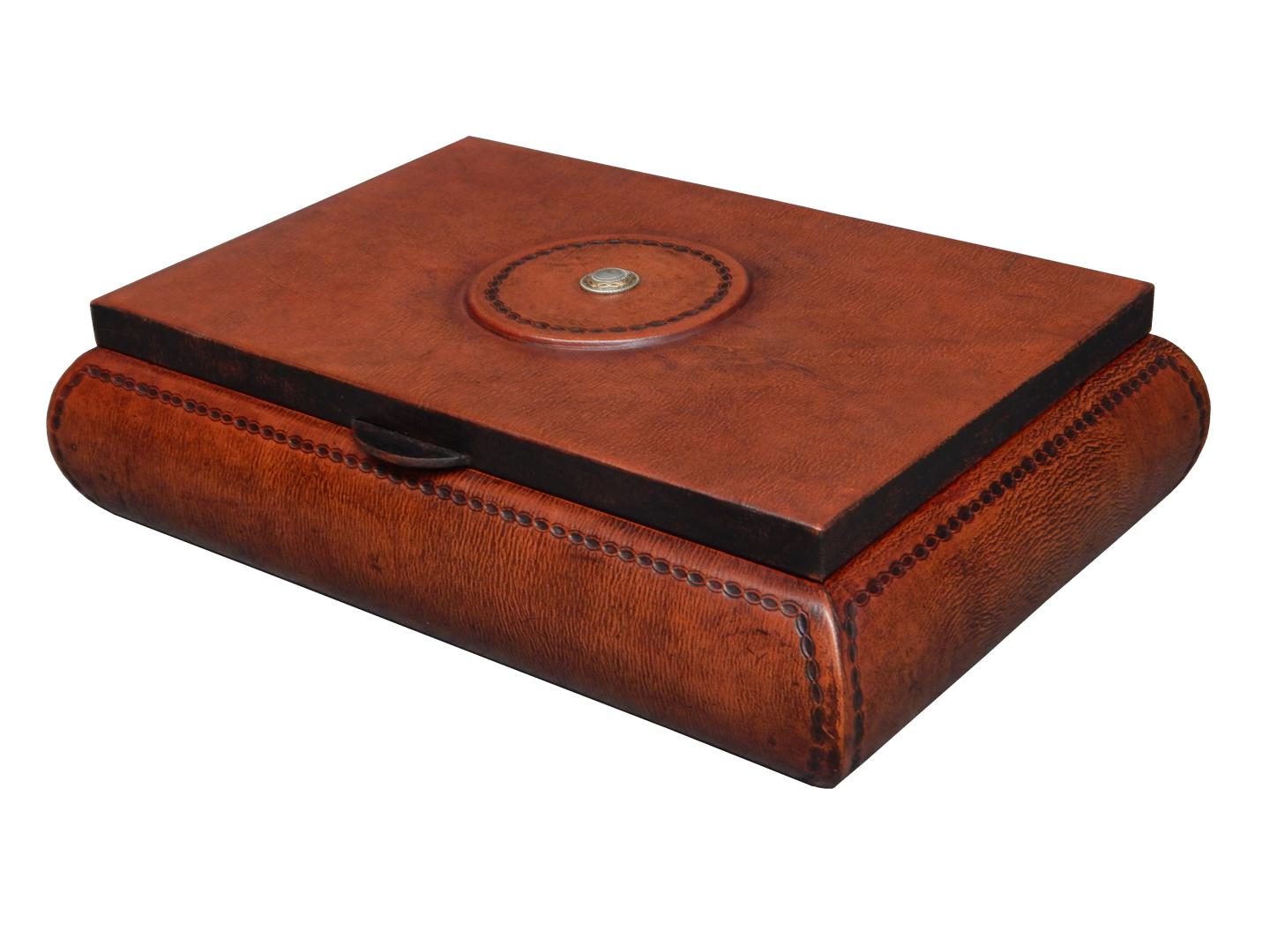 leather box with beautiful concho design on the top and wire design around the piece